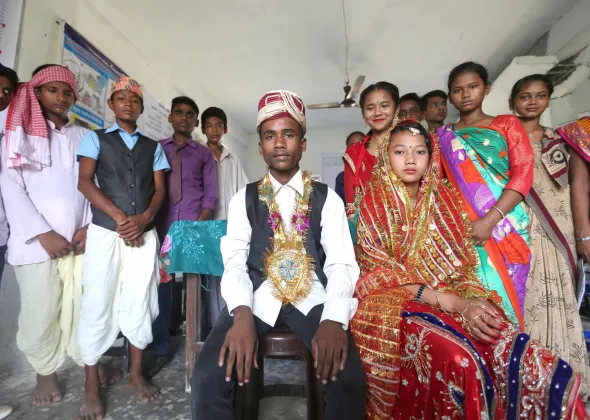 On 21 June 2018 in Nepal, Renuka Kumari Choudhary (left and seated), Rakesh Kumar Shah (right and seated) and other adolescents in Gujara Municipality of Rautahat District perform a skit on child marriage as part of UNFPA-UNICEF Global Programme on Ending Child Marriage. 