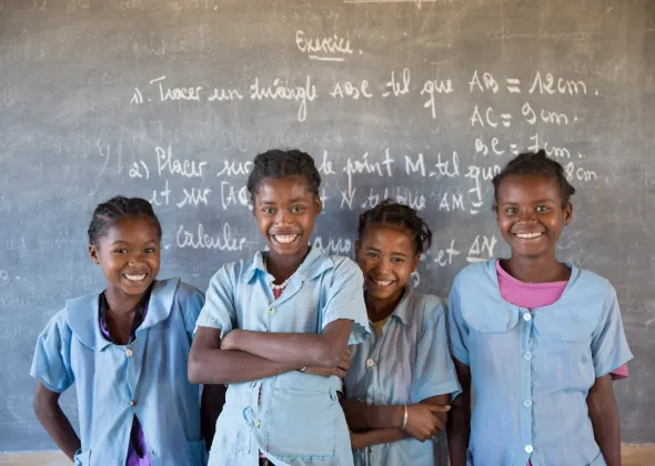 Soanafiny Fille de Jesus Clarta (second from the left), 14, studies in the secondary school of Berano (Anosy region). Thanks to the catch-up class (Let Us Learn), a UNICEF supported program she is now studying in third grade after stopping the school for a year
