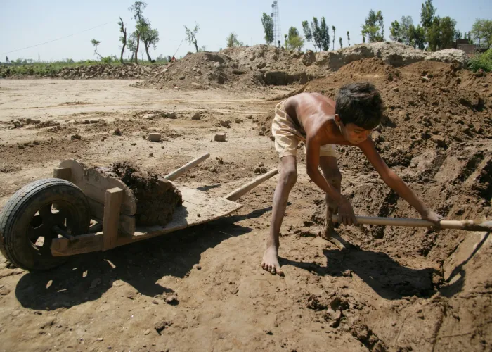 A boy collects dirt to make bricks at a factory in the Shahdra neighbourhood, north of Lahore, capital of Punjab Province. While it is illegal to employ children under 14, many children must work to support their families. UNICEF collaborates with local NGOs to provide assistance and education to working children and their families.